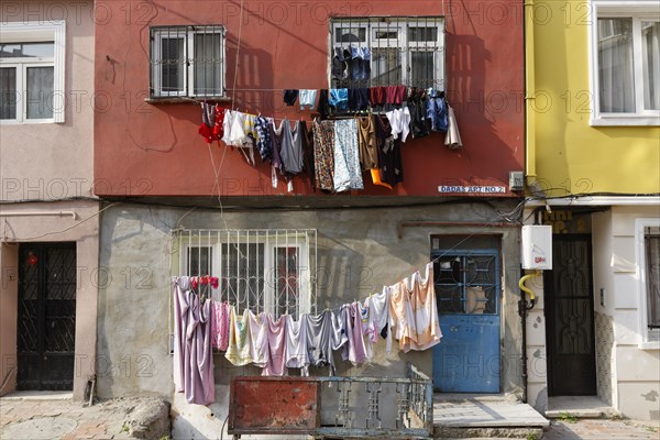 Laundry hanging on washing lines on a facade