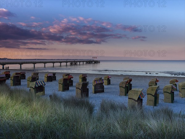 Beach chairs on the beach at dusk
