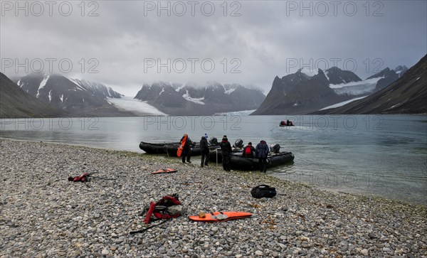 Tourists in inflatable boats