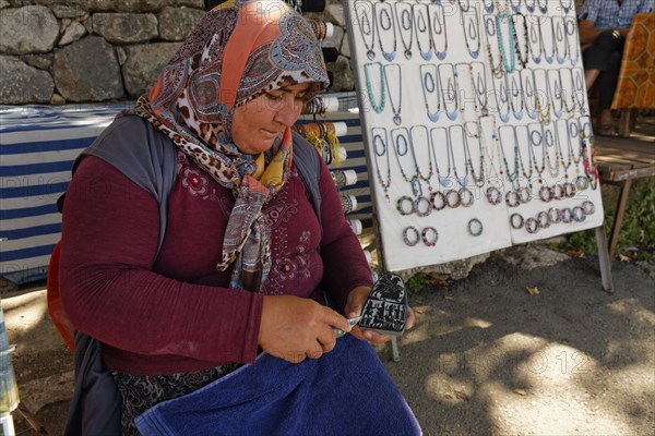 Woman carving a stone