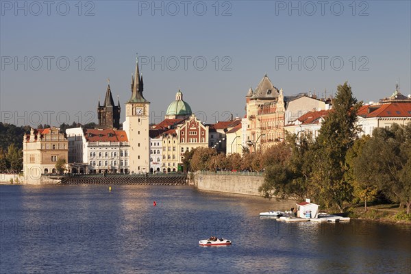 View over the Vltava River to the Bedrich Smetana Museum and the Old Town Bridge Tower