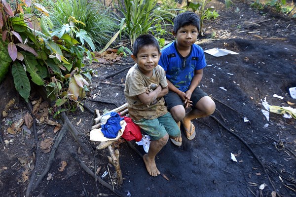 Two indigenous boys in the village of the Xavantes people