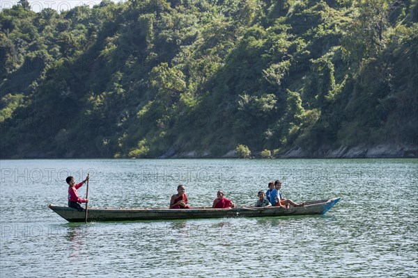 Children and novices in a boat on the Lemro River