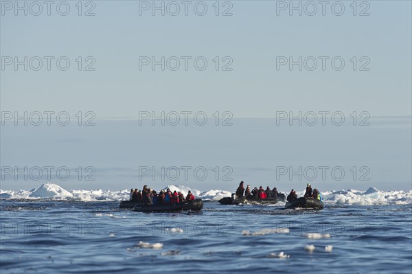 Tourists in inflatable boats