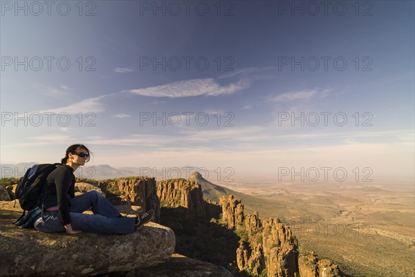 Hiker enjoying the views of the Spandau-Koppe and the Camdeboo Plains