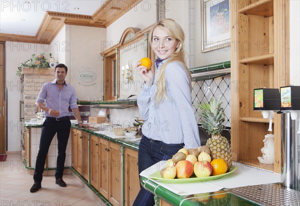 Man and woman standing at the breakfast buffet of a hotel