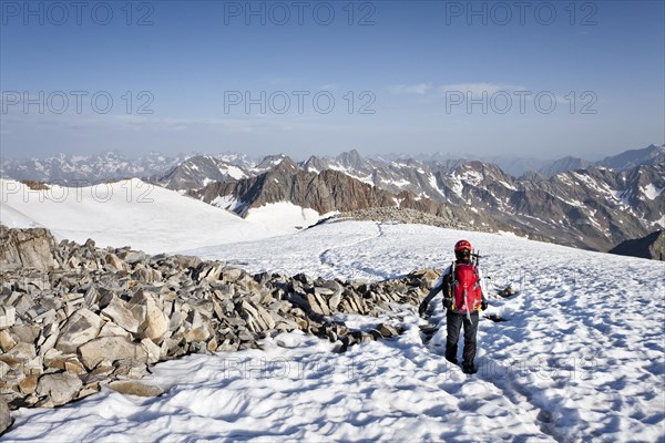 Mountaineer on the summit of Mt Wilder Pfaff