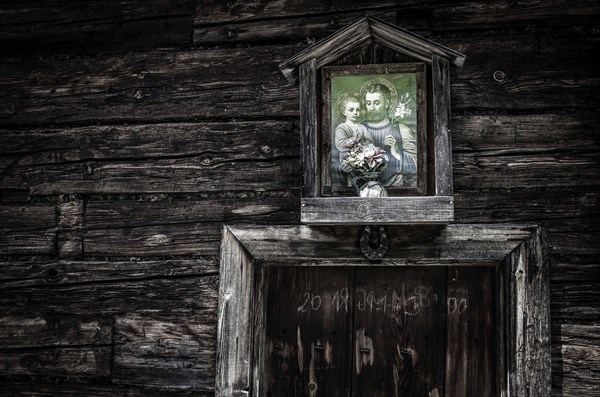 Picture of a saint on a mountain hut