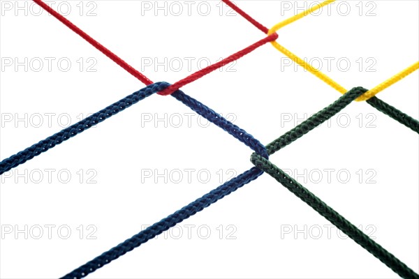 Four colored cords are intertwined