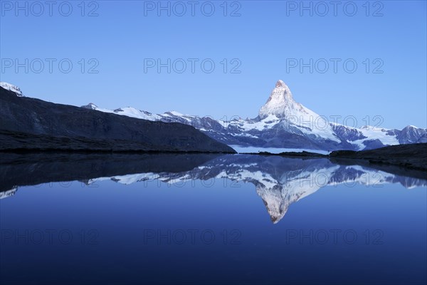 Mt Matterhorn reflected in Stellisee Lake at dusk