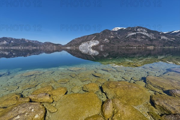 Lake Wolfgang with a reflection of the surrounding mountains