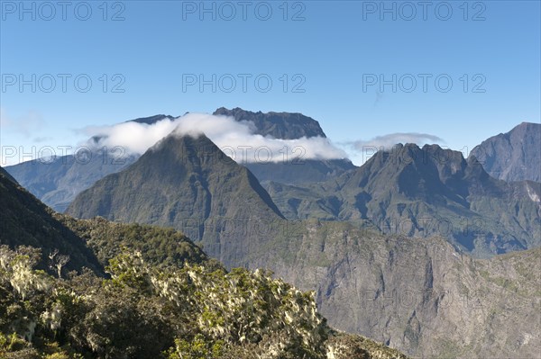 Rugged mountains with a band of clouds