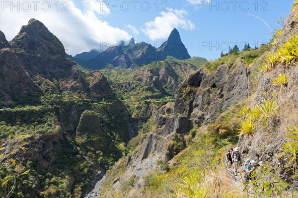 Group of hikers hiking in the rugged mountain landscape