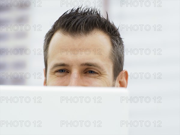 Businessman in an office with a laptop