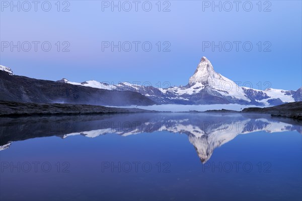 Mt Matterhorn reflected in Stellisee Lake at dusk