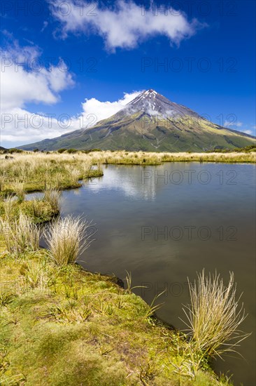 Mountain lake with the Mount Taranaki volcano