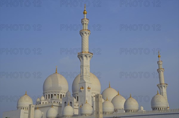 The white marble domes and minarets of Sheikh Zayed Grand Mosque