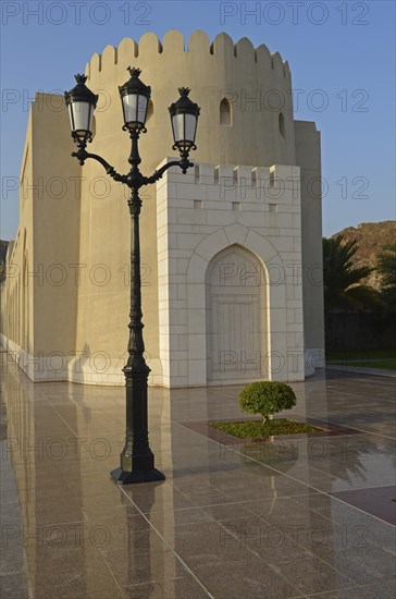 The colonnades leading to the Sultan's Palace and a street lamp
