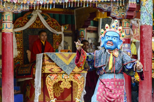 Monk performing ritual mask dance