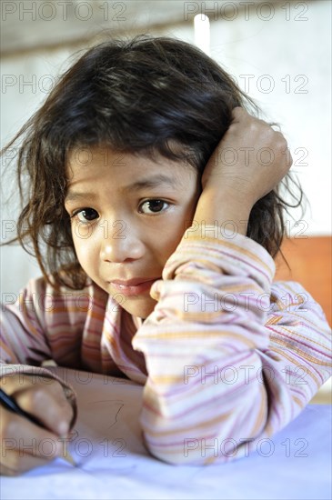 Schoolgirl writing in a notebook