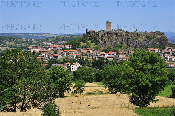 Castle of Polignac on a basalt rock above the village