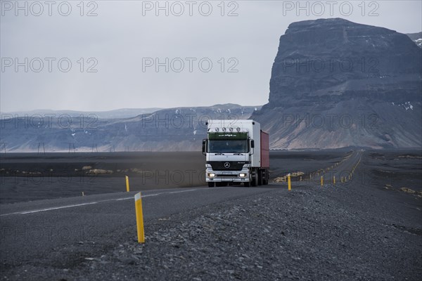 Truck driving along the Hringvegur or Ring Road
