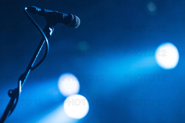 Microphone on a stand in the spotlight