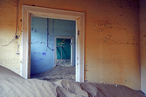 Building taken over by sand from the desert