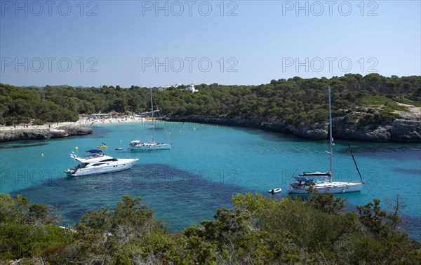 Sailing boats at sandy beach of Calo d'en Garrot