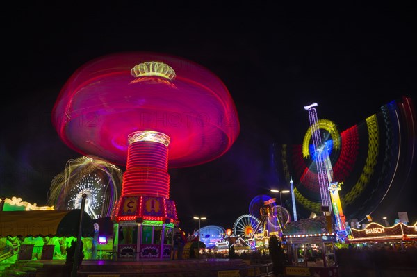 Chair-o-plane or wave swinger at night