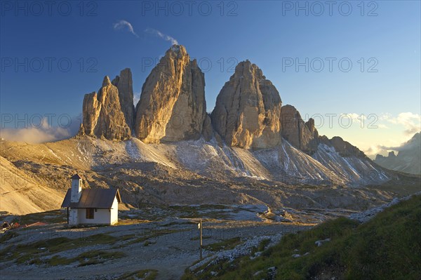 Chapel of Dreizinnenhuette or Three Peaks Alpine hut in front of the north face of the Three Peaks