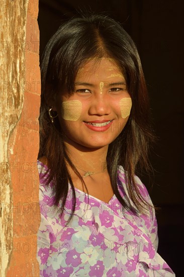 Girl with thanaka paste on her face
