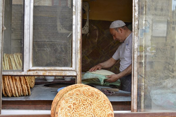 Flatbread baker in a bakery