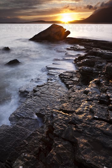 Sunset at the rocky coast