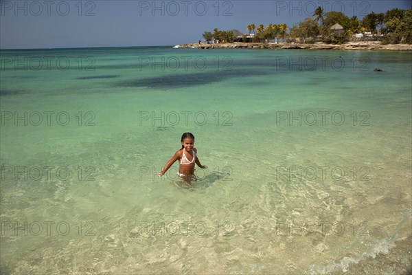 Little Cuban girl on Playa Bacuranao beach