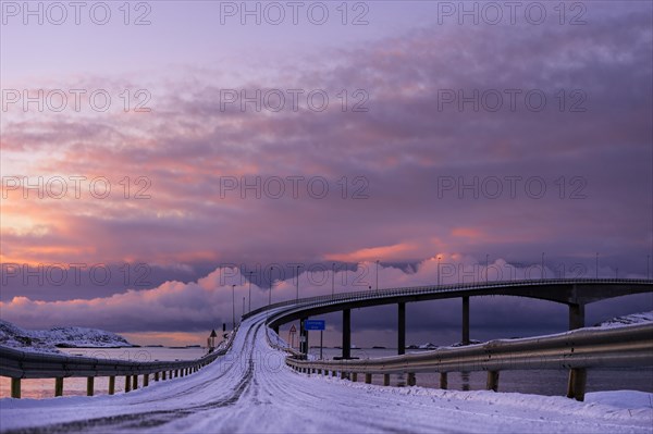 Bridge with snow-covered road in the evening light