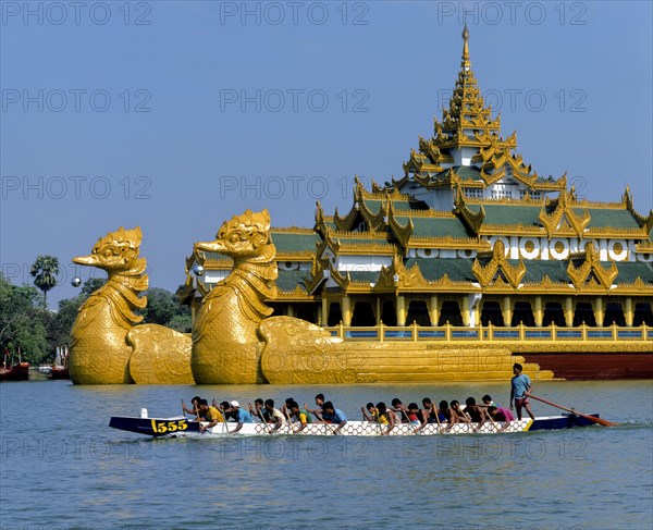 Dragon boat on Lake Kandawgyi in front of the Karaweik ship restaurant