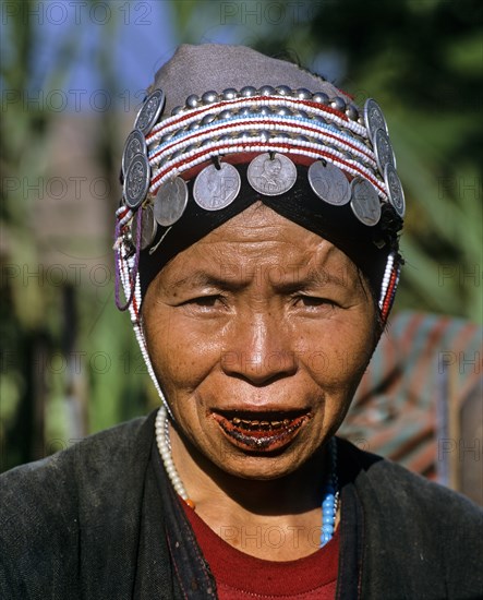 Akha woman with traditional clothing and headdress with Silbergmuenzen