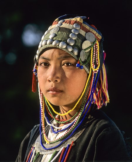 Akha girl with traditional clothing and headdress