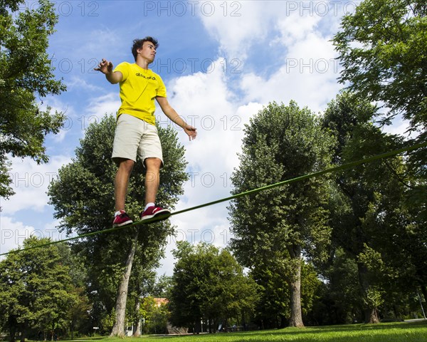 Young man balancing on a slackline