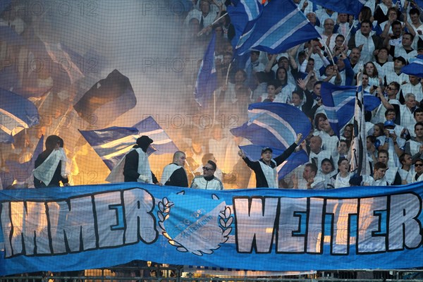 Hoffenheim fans igniting flares