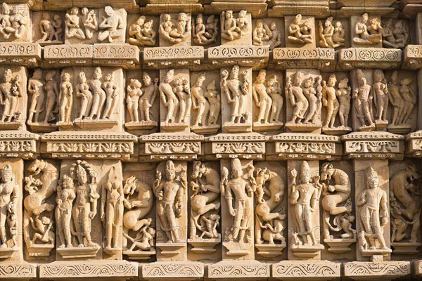 Relief sculptures of gods and men on the facade of the Parshvanath Temple