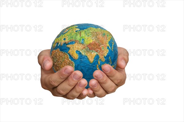 Girl's hands are holding a globe