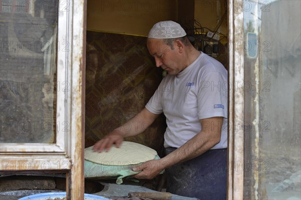 Flatbread baker in a bakery