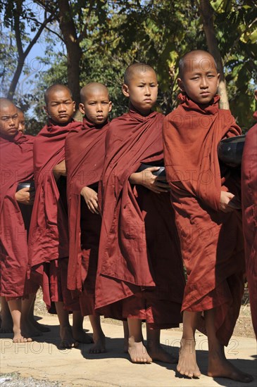 Buddhist monks collecting alms in