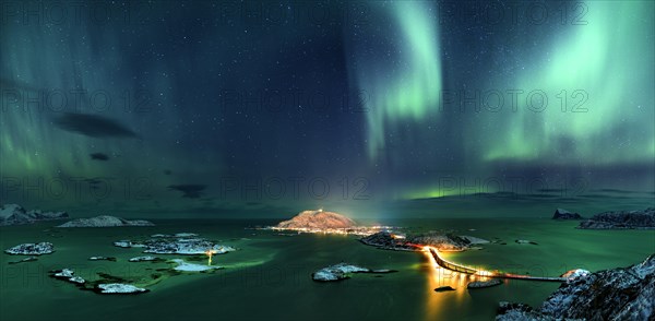 Fjord with islands in winter and the northern lights