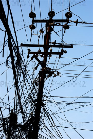 Tangled power cables on a power pole