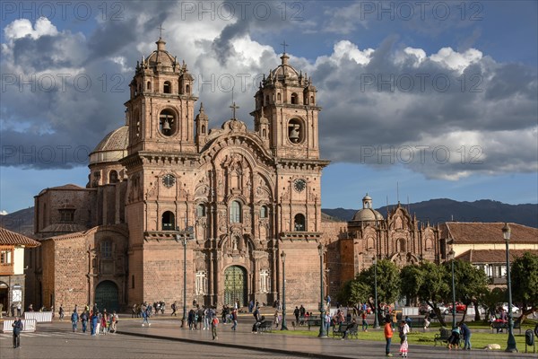 Place Plaza de Armas with the church Iglesia La Compania de Jesus at cloudy sky