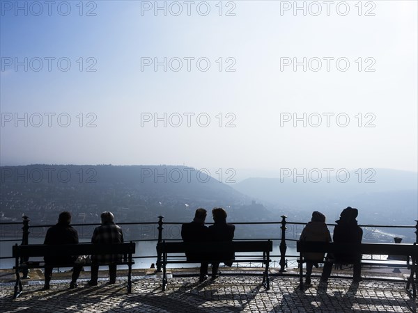 Tourists sitting on benches