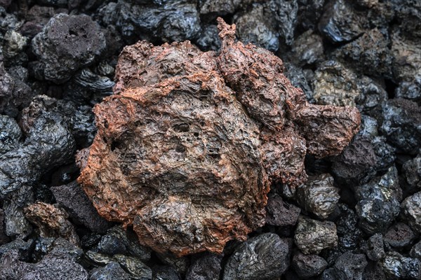 Reddish lava at the volcano Piton de la Fournaise